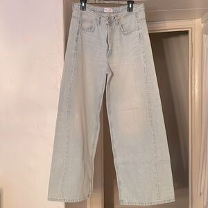 Zara denim twist leg slightly distressed around pocket. Size 10 inseam 30